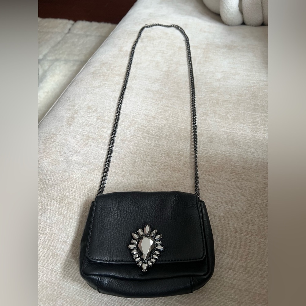 Juicy couture leather bag with rhinestones in the front with a magnet lock